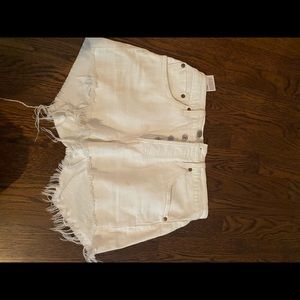 Women’s Levi’s white jean shorts.